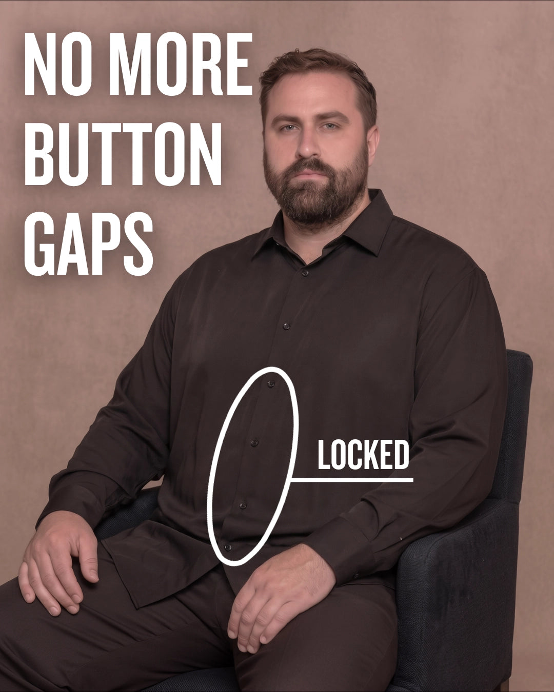 White man sitting on a chair wearing a black long-sleeve dress shirt, pointing at the button placket to show no button gap, front view