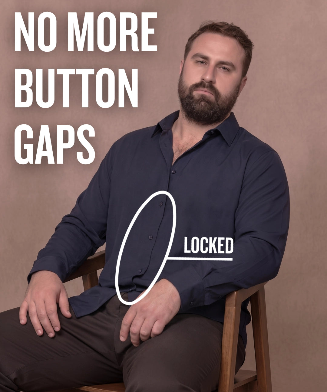 White man sitting on a chair wearing a navy long-sleeve dress shirt, pointing at the button placket to show no button gap, front view