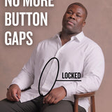 Black man sitting on a chair wearing a white long-sleeve dress shirt, pointing at the button placket to show no button gap, front view