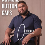 White man sitting on a chair wearing a navy short-sleeve dress shirt, pointing at the button placket to show no button gap, front view