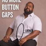 Black man sitting on a chair wearing a white short-sleeve dress shirt, pointing at the button placket to show no button gap, front view