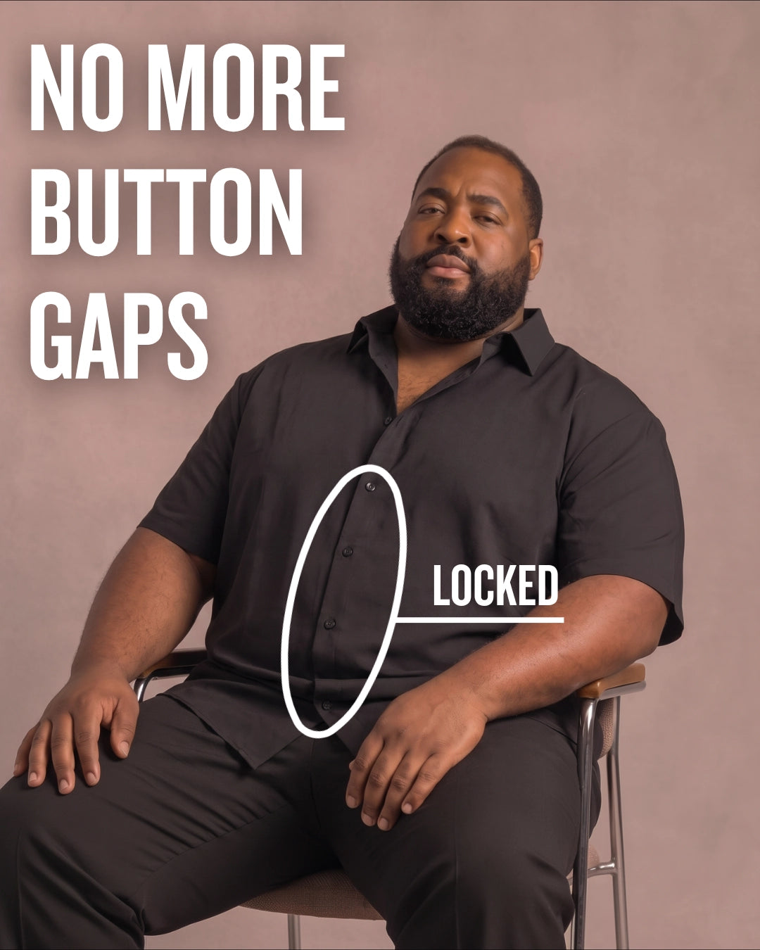 Black man sitting on a chair wearing a black short-sleeve dress shirt, pointing at the button placket to show no button gap, front view