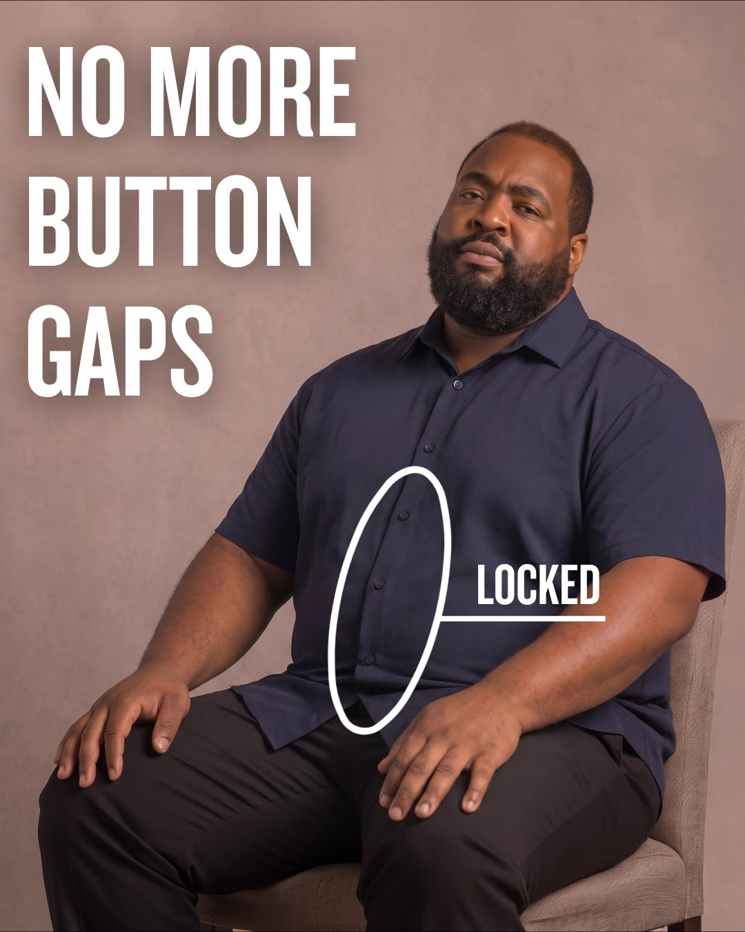 Black man sitting on a chair wearing a navy short-sleeve dress shirt, pointing at the button placket to show no button gap, front view