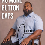 Black man sitting on a chair wearing a light blue short-sleeve dress shirt, pointing at the button placket to show no button gap, front view