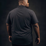 Plus-size Black man trying on NEVER GAPE No-Gap Stretch Dress Shirt in Black, Short Sleeve, back view