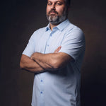 Plus-size white man trying on NEVER GAPE No-Gap Stretch Dress Shirt in Light Blue, Short Sleeve, front view