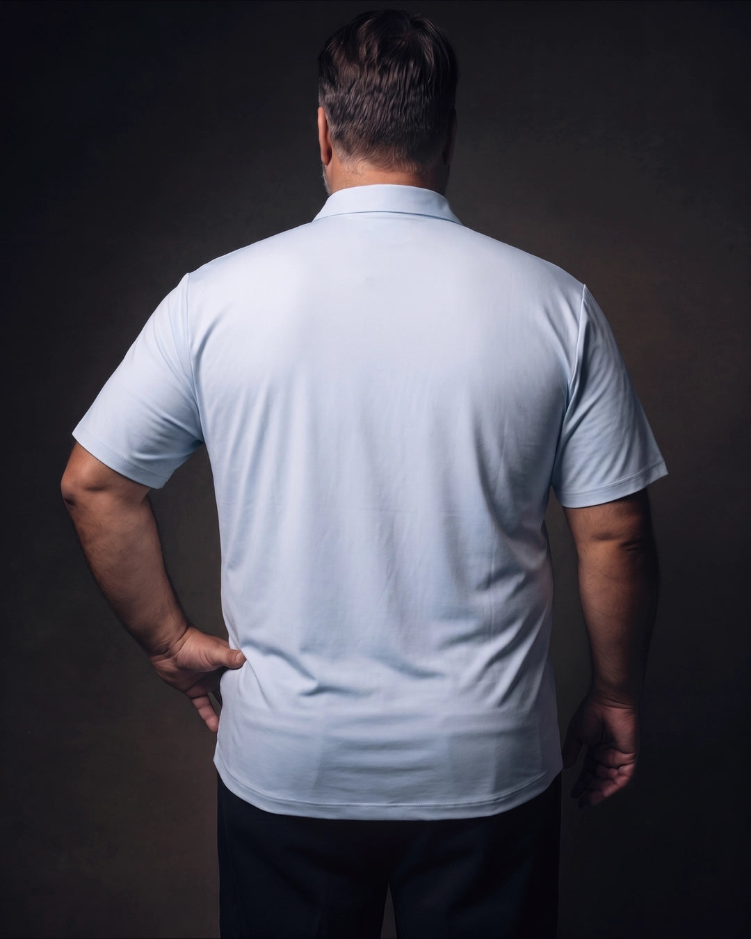 Plus-size white man trying on NEVER GAPE No-Gap Stretch Dress Shirt in Light Blue, Short Sleeve, back view