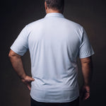 Plus-size white man trying on NEVER GAPE No-Gap Stretch Dress Shirt in Light Blue, Short Sleeve, back view