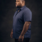 Plus-size Black man trying on NEVER GAPE No-Gap Stretch Dress Shirt in Navy, Short Sleeve, side view