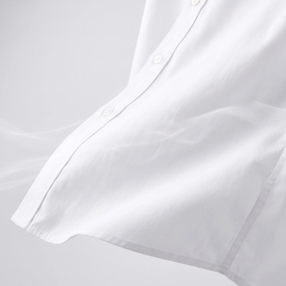 Close-up view of lightweight breathable men's dress shirt fabric showing a soft woven texture designed for warm weather comfort
