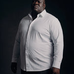 Plus-size Black man trying on NEVER GAPE No-Gap Stretch Dress Shirt in White, Long Sleeve, front view