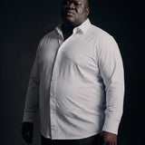 Plus-size Black man trying on NEVER GAPE No-Gap Stretch Dress Shirt in White, Long Sleeve, front view