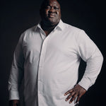 Plus-size Black man trying on NEVER GAPE No-Gap Stretch Dress Shirt in White, Long Sleeve, front view