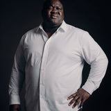 Plus-size Black man trying on NEVER GAPE No-Gap Stretch Dress Shirt in White, Long Sleeve, front view
