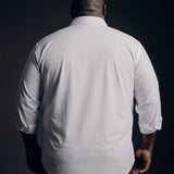Plus-size Black man trying on NEVER GAPE No-Gap Stretch Dress Shirt in White, Long Sleeve, back view