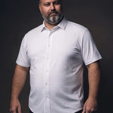Plus-size white man trying on NEVER GAPE No-Gap Stretch Dress Shirt in White, Short Sleeve, front view