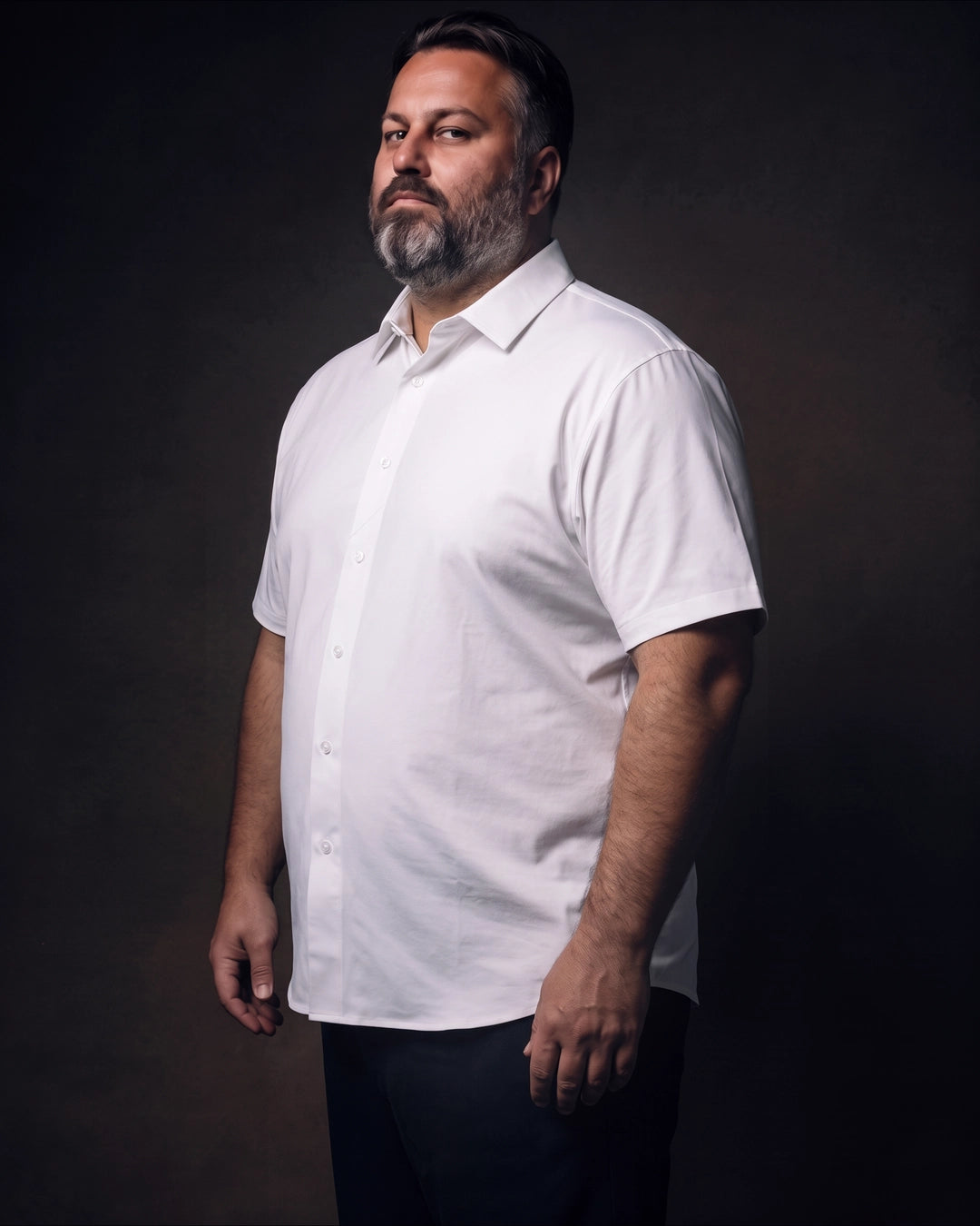 Plus-size white man trying on NEVER GAPE No-Gap Stretch Dress Shirt in White, Short Sleeve, side view