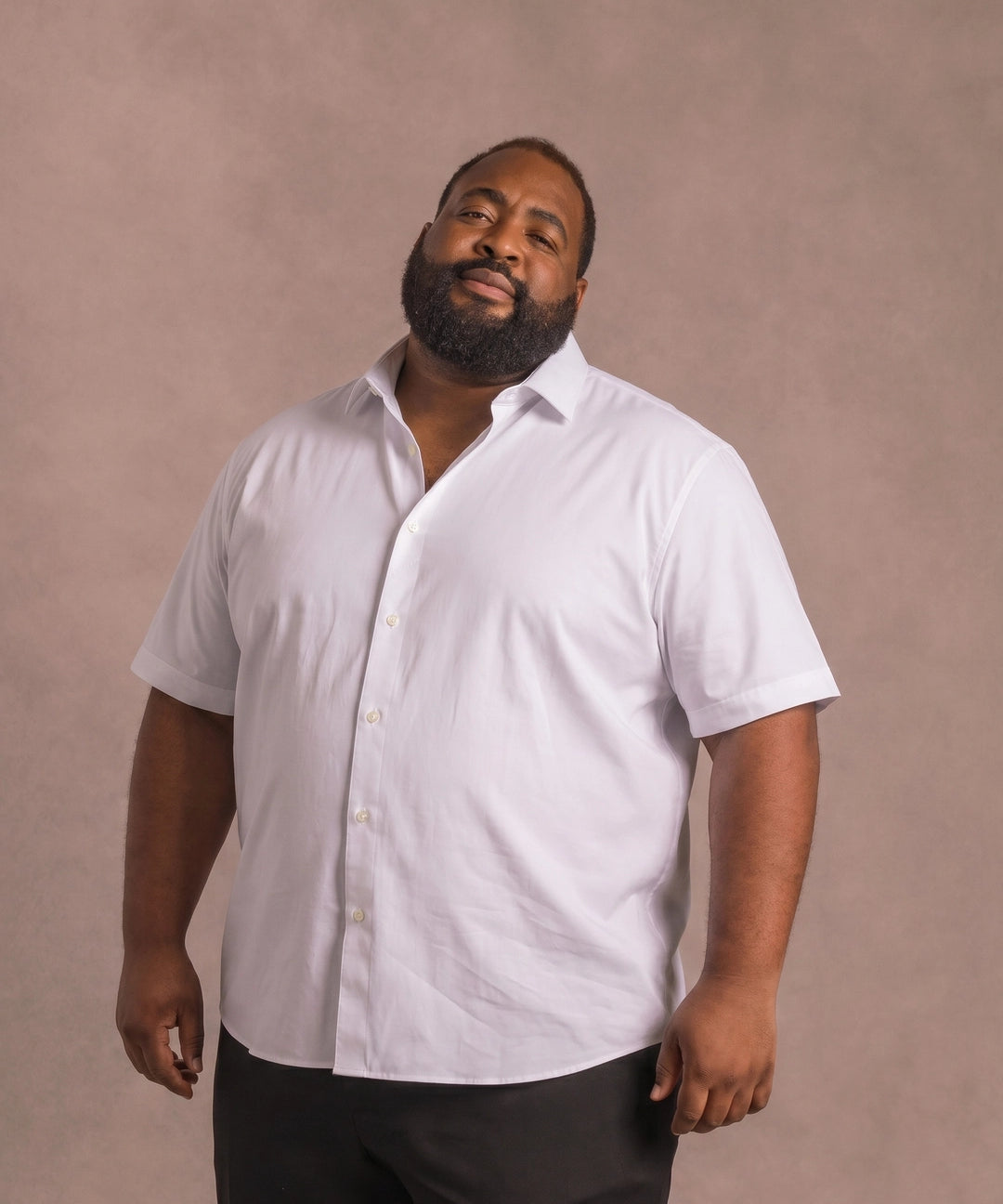 Black man wearing a white short-sleeve dress shirt, front view