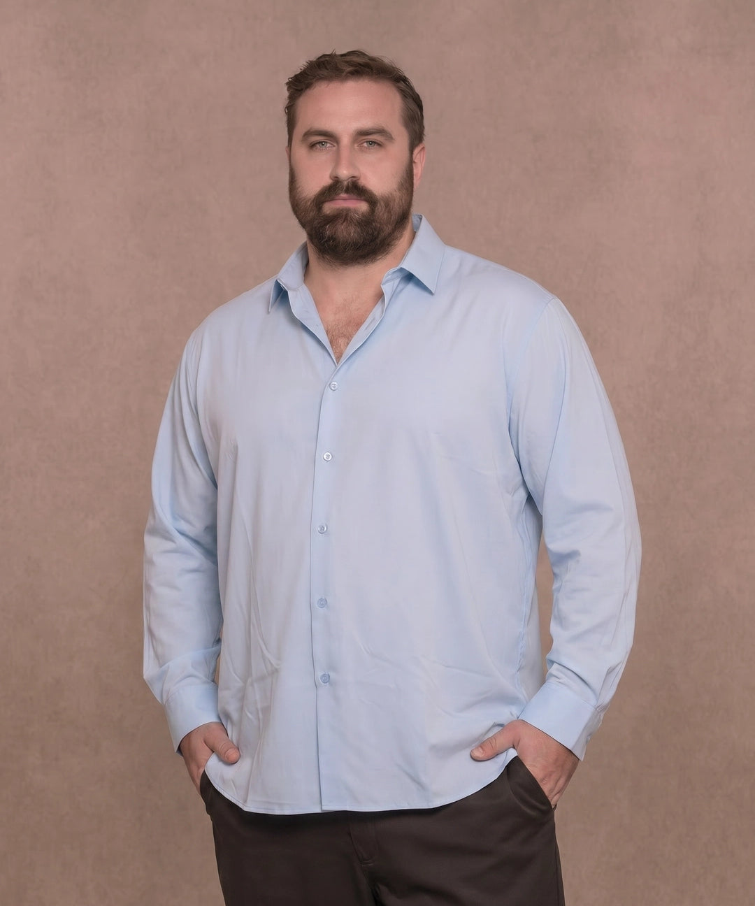 White man wearing a light blue long-sleeve dress shirt, front view