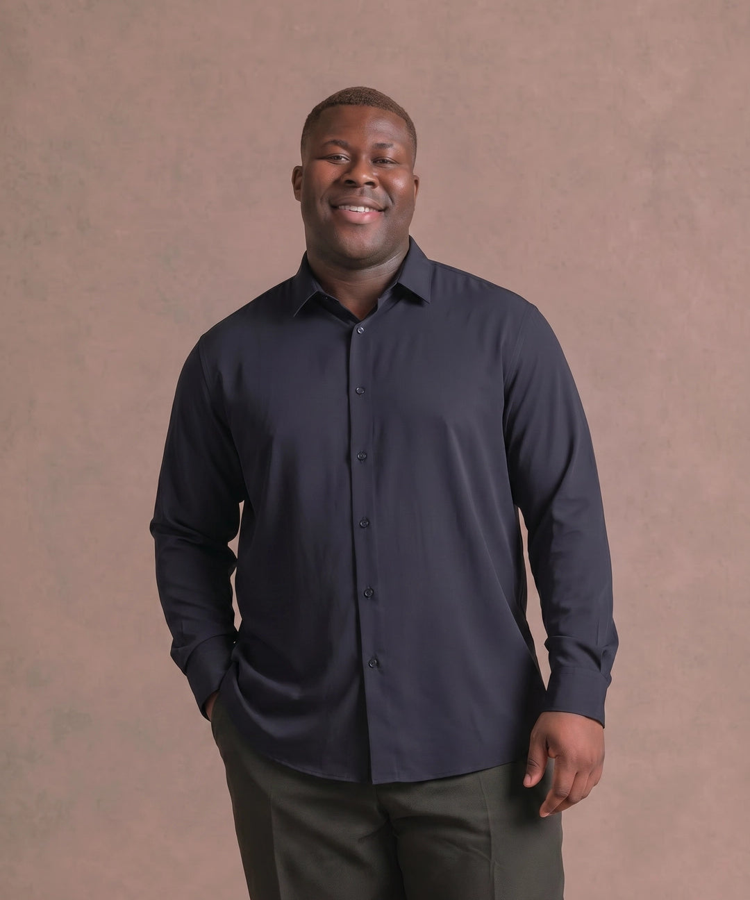 Black man wearing a navy long-sleeve dress shirt, front view