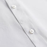 Navy dress shirt fabric detail close-up
